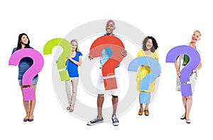 Group of people holding question marks