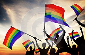 Group of People Holding Rainbow Flags