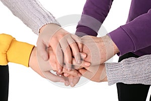 Group of people holding their hands together on white background