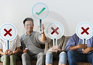 Group of people holding true & false icons