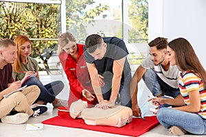 Group of people with instructor practicing CPR