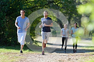 group people jogging in park
