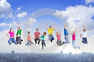 Group of people jumping above the city