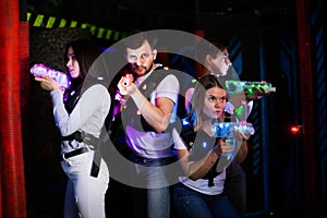 Group of people on laser tag arena