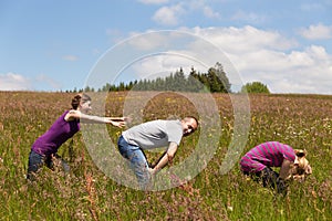 Group of people are leapfrogging