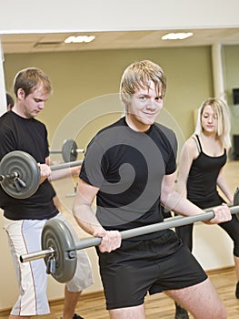 Group of people lifting weights
