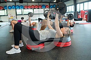 Group people lifting weights