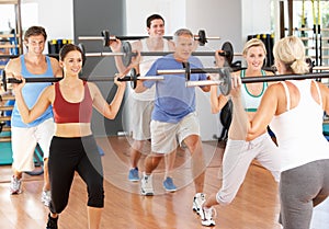 Group Of People Lifting Weights