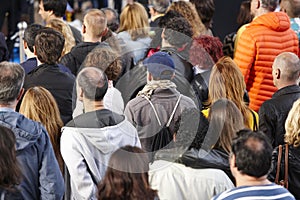 Group of people listening on the street. Urban crowded