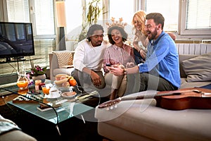 Group of people looking at cell phone