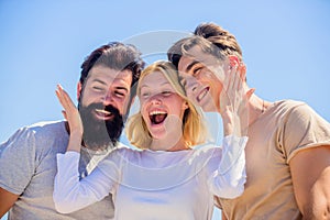Group of people outdoor. heaven concept. success heights. happy woman and two men. cheerful friends. friendship