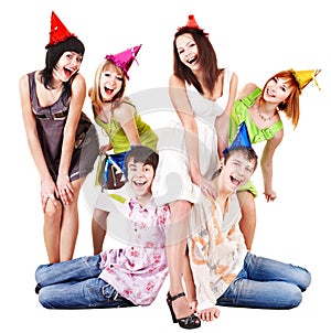 Group of people in party hat celebrate birthday.