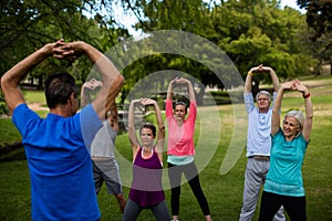 Group of people performing stretching exercise