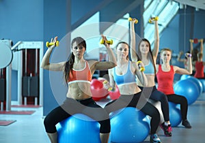 Group of people in a Pilates class at the gym