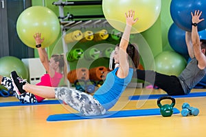 Group of people in a Pilates class at the gym