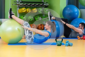 Group of people in a Pilates class at the gym