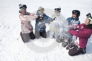 Group of People Playing in the Snow in Ski Resort