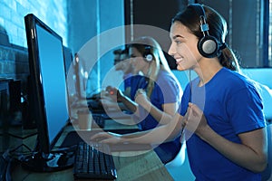 Group of people playing video games in cafe