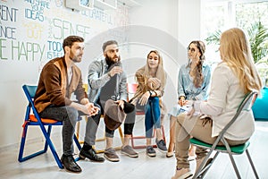 Group of people during the psychological therapy indoors