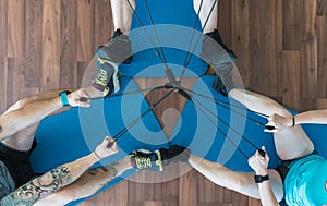 Group of people pulling bungee cords