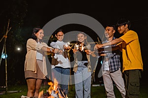 a group of people put their fireworks together