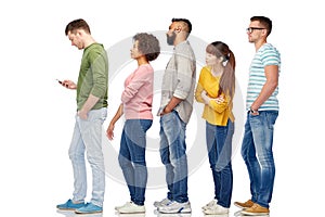 Group of people in queue with smartphone