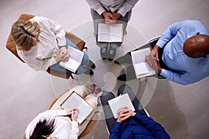 Group Of People Reading Religious Book