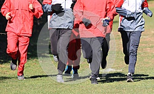 Group of People Running on Field