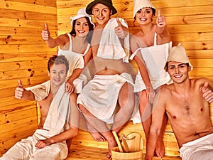 Group people in Santa hat at sauna