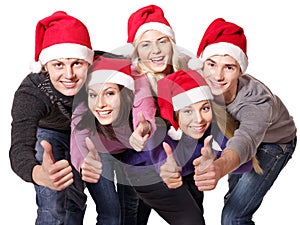 Group people in santa hat show thumbs up.