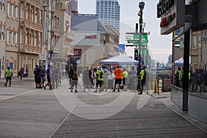 A group of people are seen standing on the boardwalk by Bally`s Casino