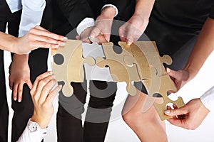 Group of people with silver gold puzzles.