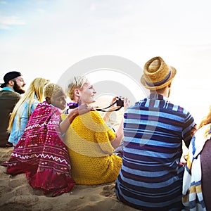 Group Of People Sitting On the Beach Concept