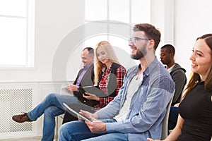 Group of people sitting at seminar, copy space