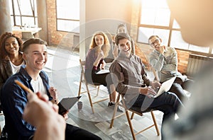 Group of people sitting at seminar, copy space