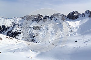 Group of people ski mountaineering and mountain snow panorama in Stubai Alps