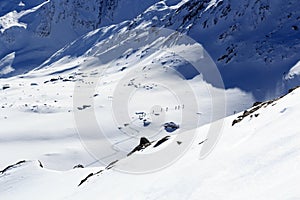 Group of people ski mountaineering and mountain snow panorama in Stubai Alps