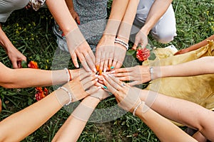 Group of people stacking hands together. Teamwork