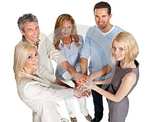 Group of people stacking their hands together