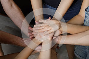 Group Of People Stacking Their Hands Together. Family, unity and team concept