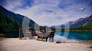 Group of people standing on a dock on Lake Antholzer See