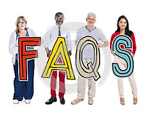 Group of People Standing Holding FAQS Letter Concept