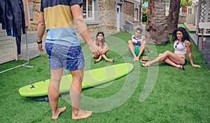 Group of people in a summer surf class