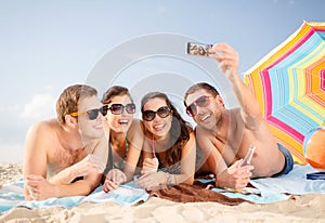 Group of people taking picture with smartphone