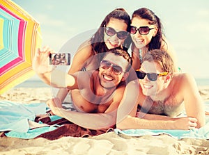 Group of people taking picture with smartphone