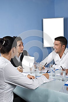 Group of people talking at meeting