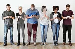 Group of people using mobile phones photo