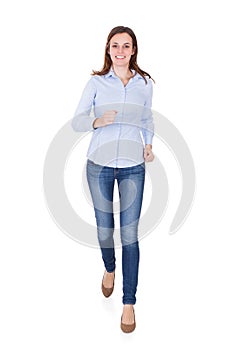 Woman In Smart Casuals Running Against White Background photo