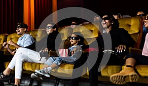 Group of people watch 3d movie in cinema theater