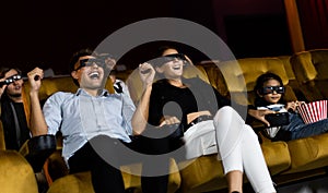 Group of people watch 3d movie in cinema theater